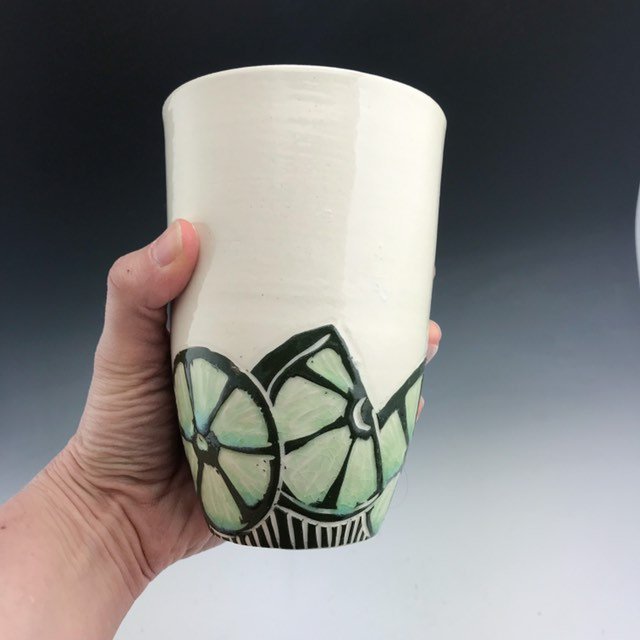 Handmade ceramic lime pint tumbler in sgraffito with green glaze interior